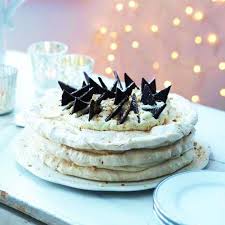 A layer of sweet white chocolate. Nut Meringue Cake With Baileys Cream Shards Of After Eight Mints Top Layers Of Feather Light Christmas Food Desserts Christmas Desserts Best Meringue Recipe