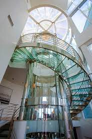 Florida Beach Pad With Round Glass Elevator For 6m Round Stairs Glass Elevator Glass Stairs