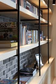 Dark Apartment Interior Design For A Young Family In 2020 Apartment Interior Design Built In Bookcase Brick Accent Walls