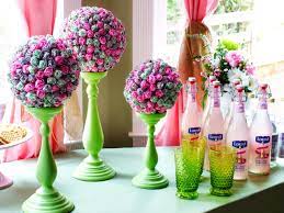 Stick lollipops into a jar of colored sugar art. How To Make A Lollipop Topiary Centerpiece How Tos Diy