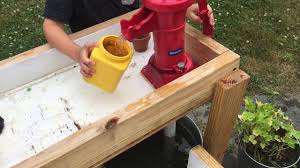 Montessori Inspired Diy Hand Pump Water Table For Kids Hand Water Pump Kids Water Table Water Table