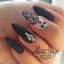 Oval Short Black Almond Shaped Nails Oval Shaped Nails With Black Gel Polish And Matte Top Coat Black Floral Art With Sugaring And Rhinestones Beautiful Nail Jewels Rhinestone Nails Nail Designs
