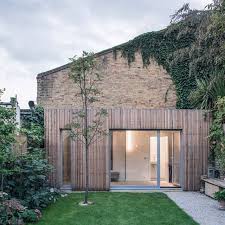 Dezeen On Instagram Slender Batons Of Untreated Larch Cover Two Extensions Erected In The Garden Of This Semi Detac Architecture Facade House Victorian Homes