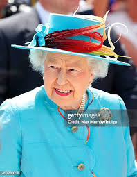 Queen Elizabeth II unveils a plaque while visiting Reading Railway... News  Photo