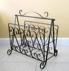 Make this black and gold magazine rack do the work of keeping like items all in one place. Mid Century Wrought Iron Black Magazine Holder Lp Holder Vinyl Record Storage Boho Home Decor Newspaper Rack Retro Metal Scrollwork Wrought Iron Magazine Rack Decor Vinyl Record Storage