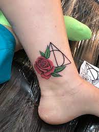 Maybe you would like to learn more about one of these? My First Tattoo Deathly Hallows With A Pretty Rose Harrypotter