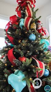 How To Put Ribbon On A Christmas Tree Upright And Caffeinated When decorating your christmas tree this year, don't forget to add the ribbon. how to put ribbon on a christmas tree