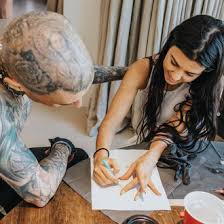 Young instagram and high fashion runway models are often spattered with tiny, artsy tattoos. Kourtney Kardashian Gave Travis Barker A Tattoo