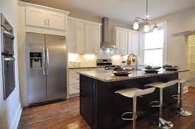 Updated Kitchen White Shaker Cabinets And An Espresso Shaker Cabinet Island Both With Marble Si Espresso Kitchen Cabinets Kitchen Decor Custom Kitchen Island