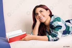 Young girl daydreaming while reading a book - stock photo 1174698 |  Crushpixel