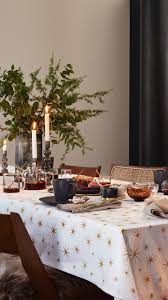 H M Home Set The Scene For A Festive Holiday Get Together With A Star Studded Table Cloth Grey Tableware And Golden H M Home Modern Sofa Table Winter Table