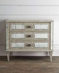 It is made of solid wood and has got wooden legs that support the whole construction. Lometa Antiqued Mirrored Chest Neiman Marcus