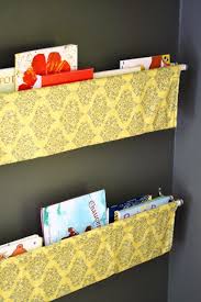See more ideas about book holders, holder, book stands. Love This Idea Instead Of Shelves Using Farbic And Two Very Cheap Rods To Create More Basket Like Holders So Easy To Make Diy Wall Books Room Diy Book Sling