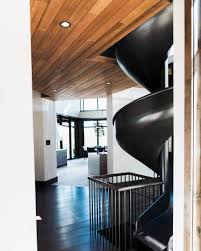 No more stairs to get from one level to the bottom, and none of those institutional playground models, either: Top 70 Indoor Slide Ideas Skip The Boring Staircase