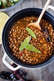 Pinto beans are simmered with onion, tomatoes, chili powder, cumin and garlic. Mexican Pinto Beans Feasting At Home
