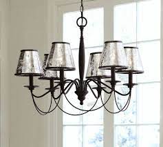 These mercury glass shades look great on their own without any illumination from inside, and just reflecting ambient light. Antique Mercury Glass Chandelier Shade Set Of 3 Pottery Barn