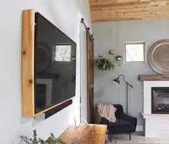 This white tv frame has more of a cottage style going for it. How To Build A Tv Frame Domestic Imperfection