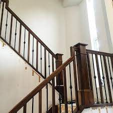 New Stair Railing Going In Loving The Alternating Wood And Metal Balusters We Went With Sidenote Their Sho Metal Stair Railing Wood Balusters Stair Railing