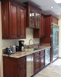 Red Cherry Rope Cabinets With Decorative End Doors And Typhoon Bordeaux Granite Cherry Wood Kitchen Cabinets Cherry Cabinets Kitchen Kitchen Cabinet Design