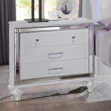 Contemporary bedroom valentino collection by ncfurniture 5 piece set includes bed, 2 night stands, dresser & mirroror bed, 1 night stand, dresser, mirror & chest white finish hardwood solids and veneers with embossed inlay led light on headboad and mirror mdf drawer english. New Classic Valentino 552396915 Three Drawer Nightstand With Mirror Accents Sam Levitz Furniture Nightstands