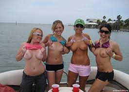 Spring Break Flashing Coeds on a Boat - Naked and nude in public pictures