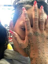 If you think about it, her hand is right there and the also in 2012, rihanna replaced her music notes tattoo with an egyptian falcon shaped in a gun just above. A Guide To Rihanna S Tattoos Her 25 Inkings And What They Mean Capital Xtra