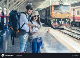Multiethnic Travelers Are Looking At The Map At The Train Station Photo Train Station Photo Train
