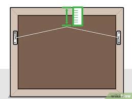 Demonstration for tying a locking knot for a picture hanging wire How To Hang Artwork With Wire 11 Steps With Pictures Wikihow
