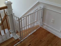 Placing baby gate to the entrance of stairs. Case Studies Baby Proofing Montgomery
