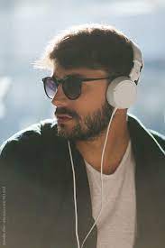 Find over 100+ of the best free boy pose images. Young Man Listening To Music With Headphones By Davide Illini Headphones Music Headphones Music Aesthetic