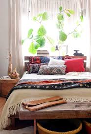 Add plenty of throw pillows and blankets on the seating or sleeping area as well as draped curtains in the same color as the pillows. 11 Moroccan Bedding Ideas Moroccan Bed Moroccan Decor Moroccan Fabric