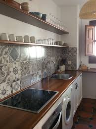 simple kitchen with open shelves in beach appartment of playa granada andalusia beautiful tiles vintage bestile kuchen ideen kuchen in u form kuche