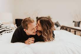 In Home Couples Photoshoot On The Bed Jumping On The Bed Playful Fun Photoshoot Ideas In Couples Photoshoot Christmas Couple Pictures Indoor Engagement Photos