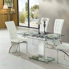 The glass makes it modern and makes sure that you'll see every piece of dirt so you can clean the dining table. Enke Extending Dining Table In Clear Glass And Chrome Frame Mysmallspace Uk