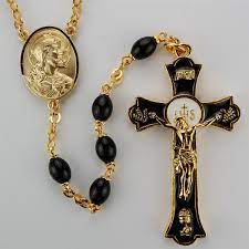 Gold capped black crystal beads rosary with gold finish links, our lady of miracles center and an oxidized gold finish crucifix. Black Glass Holy Mass Rosary
