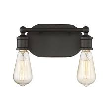 With a hint of texture on the glass shade to blur the glare of the bulb, this elegant sconce is perfect for a bathroom or vanity setting that calls for bright, but not harsh, light. Industrial Bathroom Vanity Light By Trade Winds