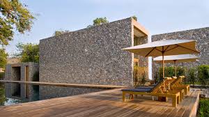 Featured here are steps with cable rail leading down to the lower terrace. The Top 5 Woods For Decks And Porches