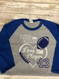 Personalized the front with your layers name and/or number! Like The Game Love The Player Football Shirt Glitter Etsy Sports Mom Shirts Football Mom Shirts Football Shirt Designs