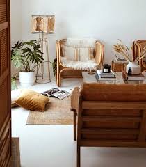 Bright interior design of living room with stylish grey furniture with pink plaid on sofa, rattan pot with green plant with beautiful wooden floor lamp, two wood interior of the billiard room. Design Crush Rattan Chairs Livvyland Austin Fashion And Style Blogger