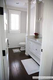 Christmas In The Powder Bathroom The Sunny Side Up Blog White Bathroom Cabinets Wood Floor Bathroom Dark Floor Bathroom
