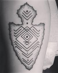 In this article i am going to be discussing the simple black tattoos that are perfect for beginners and veterans alike. Simple Black Ink Ancient Arrowhead Tattoo On Arm Stylized With Tribal Ornaments Tattooimages Biz
