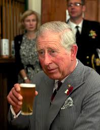 Prince Charles, Prince of Wales drinks ...