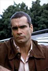 A young man about to get married earns extra cash by driving a local mobster, but things go awry when the mobster is shot dead by a rival crime boss. Scenes Of The Crime 2001