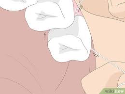 Thread a piece of floss into the eye of the threader. How To Floss 14 Steps With Pictures Wikihow