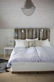 How to make a headboard from items such as wallpaper, fabric, wood shims, old shutters. 13 Diy Headboards Made From Repurposed Wood