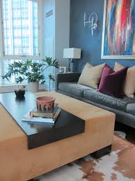 I love the idea of using a large tufted ottoman as a coffee table. Love This Ottoman Coffee Table Dual Purpose In A Chicago High Rise By Lisa Wolfe Design Coffee Table Home Decor Ottoman Coffee Table