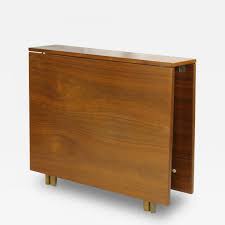 The legs of this table looks a bit curved which looks like a bit vintage; Scandanavian Mid Century Modern Teak Tuck Away Dropleaf Table