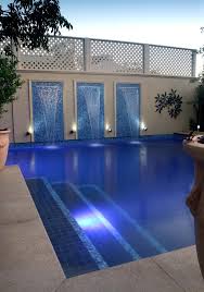 Feature Tiles On The Steps In A Dark Pool Are Not Only Practical But Can Appear Inviting Into The Calming Water Also Note Pool Water Features Pool Oasis Pool