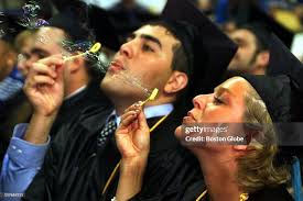 Yeh Diab of Amherst, N.H. and Shawn Dolan of Syracuse, N.Y. blow... News  Photo