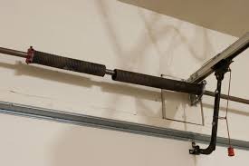 What To Do When Garage Door Spring Is Broken For Garage Door Safety Http Www Daytong Garage Door Torsion Spring Broken Garage Door Spring Garage Door Springs